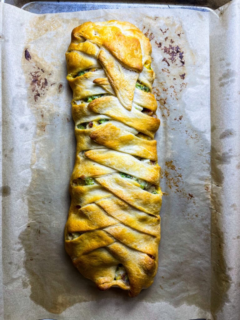 This easy Cheesy Chicken Bacon Crescent Braid is buttery crescent dough stuffed with a creamy, cheesy chicken, broccoli, and bacon filling and baked until golden brown. It's perfect for a quick weeknight dinner, a scrumptious appetizer or for a game day snack.