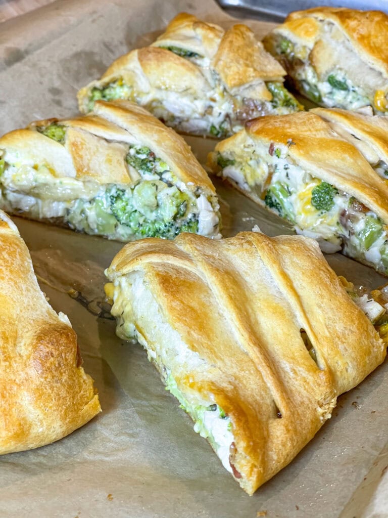 This easy Cheesy Chicken Bacon Crescent Braid is buttery crescent dough stuffed with a creamy, cheesy chicken, broccoli, and bacon filling and baked until golden brown. It's perfect for a quick weeknight dinner, a scrumptious appetizer or for a game day snack.