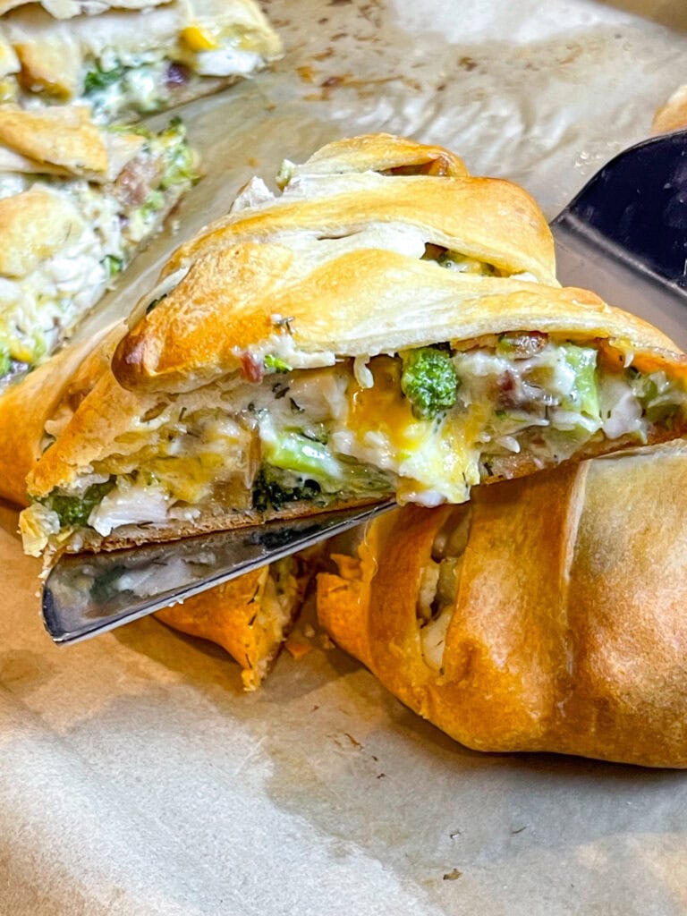 This easy Cheesy Chicken Bacon Crescent Braid is buttery crescent dough stuffed with a creamy, cheesy chicken, broccoli, and bacon filling and baked until golden brown. It's perfect for a quick weeknight dinner, a scrumptious appetizer or for a game day snack. 