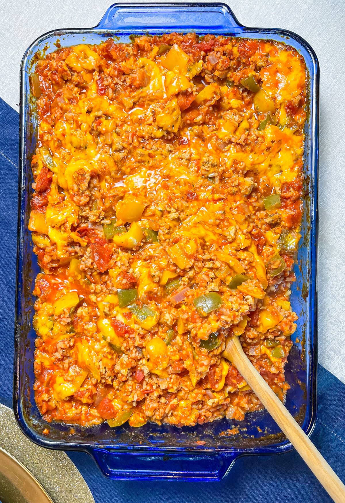 This casserole is well rounded with a carb (brown or white rice), protein (ground turkey or lean ground beef), and your vegetables (onions, bell peppers, and canned diced tomatoes).