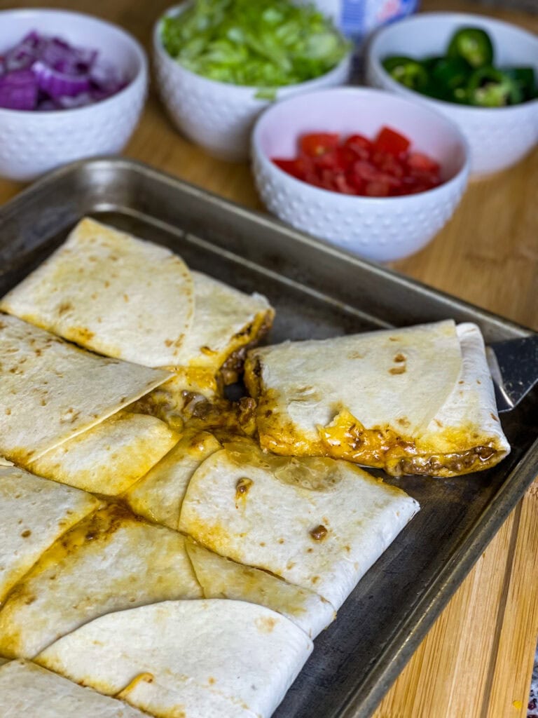 Sheet Pan Quesadillas are easy, kid friendly, quick, and they feed a crowd! Keeping the filling simple allows everyone to customize their favorite toppings.