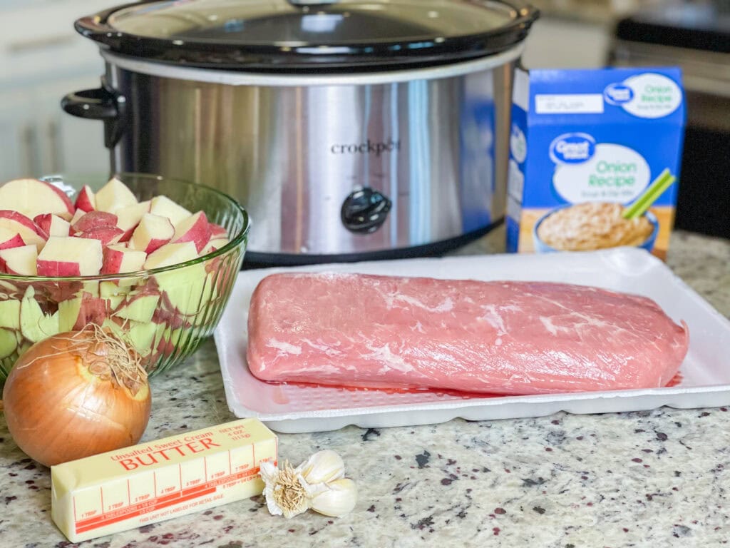 Crock Pot Buttery Onion Pork Loin is the perfect recipe for a holiday (I love this on New Year's Day), a Sunday supper or when company's coming. It's a tender, juicy pork loin smothered in onions and butter, cooked low and slow in the crock pot and finished with a savory gravy. And it's so easy!