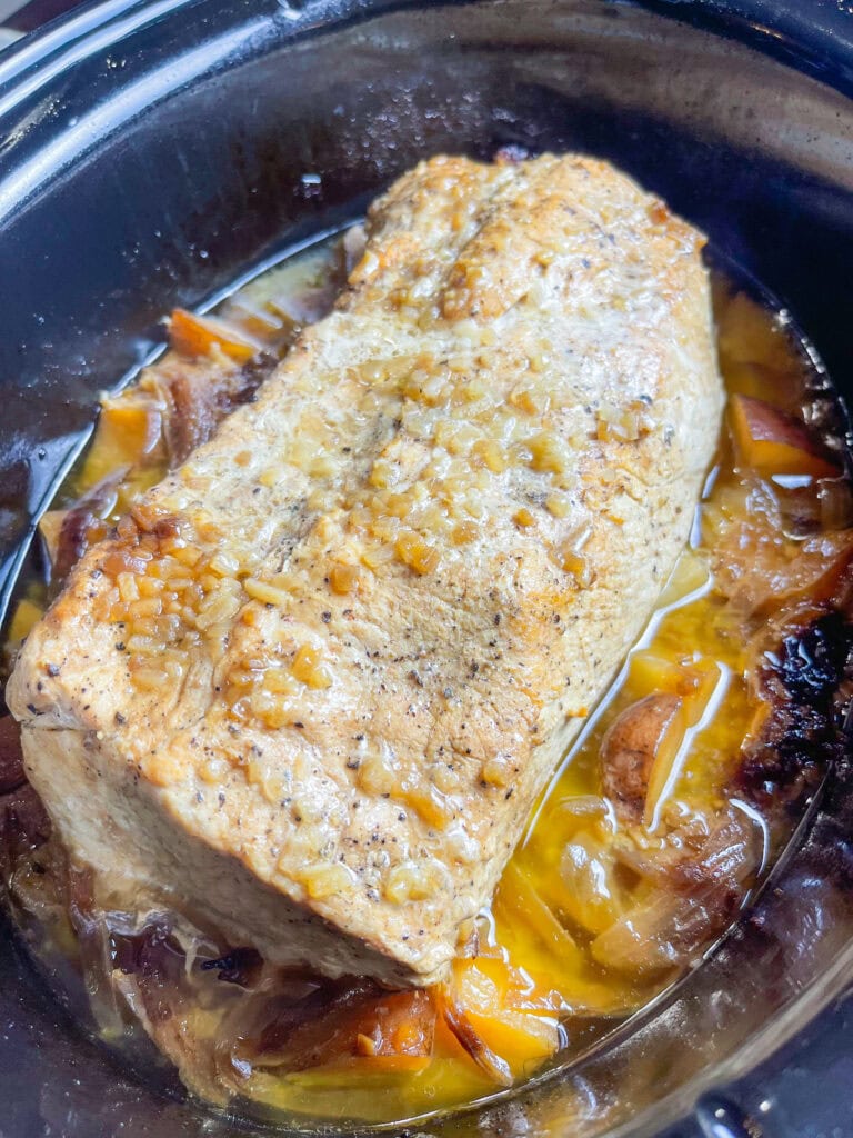 Crock Pot Buttery Onion Pork Loin is the perfect recipe for a holiday (I love this on New Year's Day), a Sunday supper or when company's coming. It's a tender, juicy pork loin smothered in onions and butter, cooked low and slow in the crock pot and finished with a savory gravy. And it's so easy!